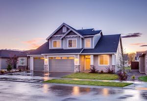 Photo by Binyamin Mellish - Telugu Word Elegant suburban home with driveway at sunset showcasing modern architecture.