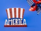 Red, white, and blue America-themed decor featuring stars and stripes on a vibrant blue background.