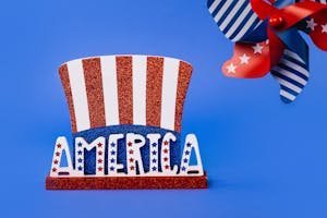 Red, white, and blue America-themed decor featuring stars and stripes on a vibrant blue background.